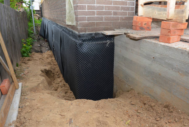 Happy homeowners after waterproofing job in Ellenwood
